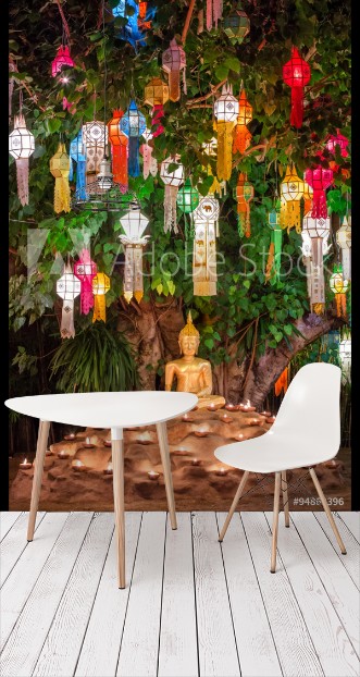 Picture of Buddha statue surounded by candles during Loy Kratong Festival